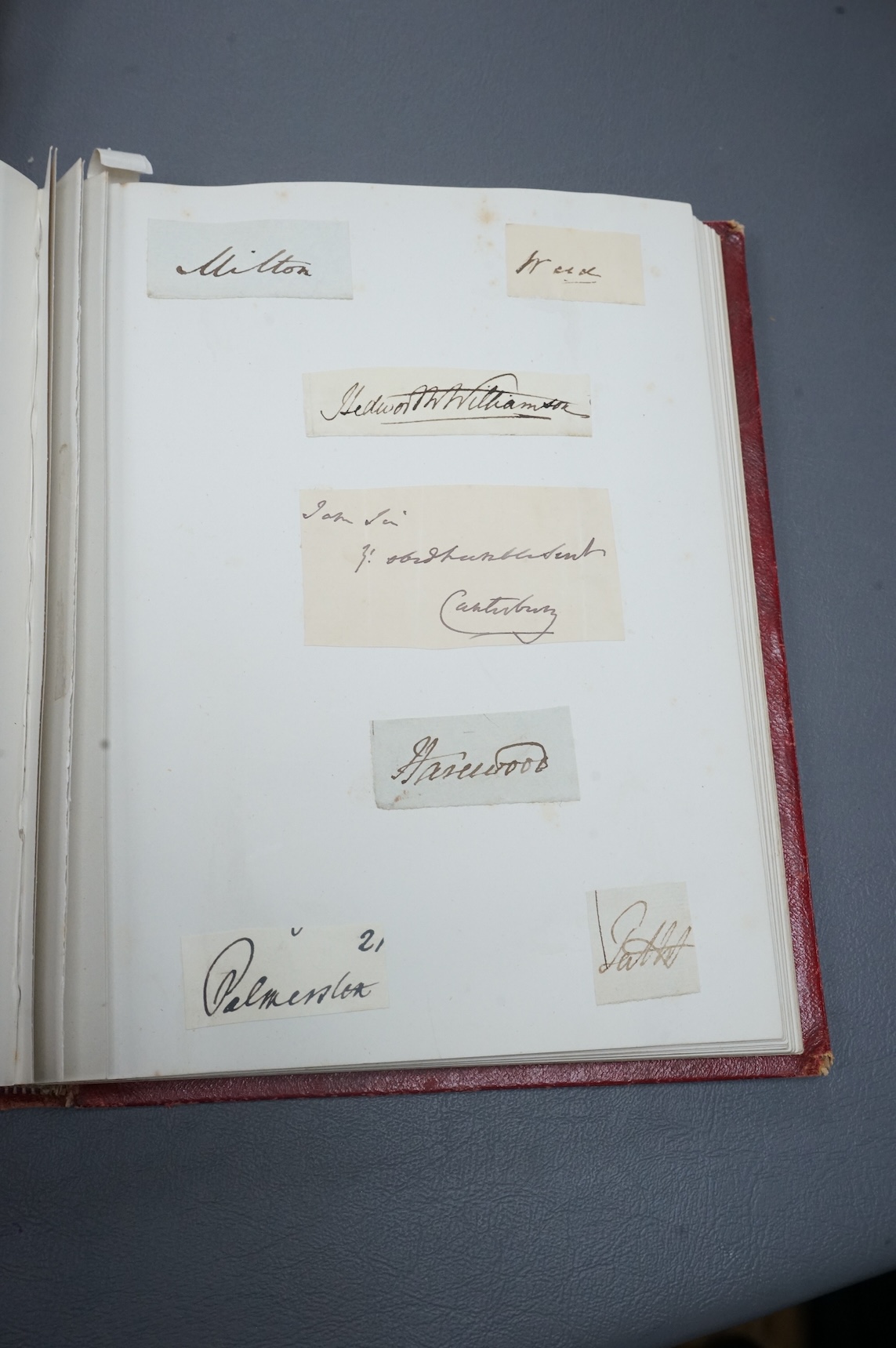 A Victorian autograph book containing a collection of complete letters, partial letters and cut out signatures from leading and influential figures primarily from the second half of the nineteenth century, many of the ex